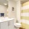Bathroom with large vanity and ample lighting